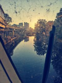 River amidst buildings against sky in city