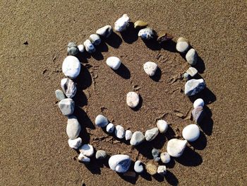 Close-up of stones and sand on beach