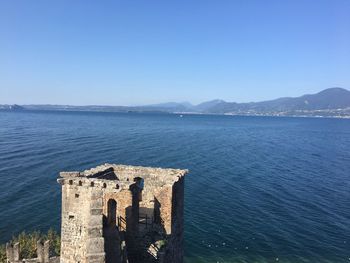 Scenic view of sea against clear blue sky