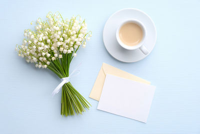 High angle view of white and coffee on table