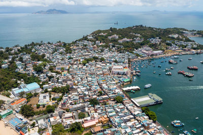 High angle view of harbor and buildings in city