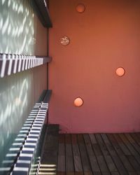 Low angle view of illuminated lamp in building