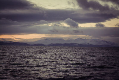 Scenic view of mountains against cloudy sky