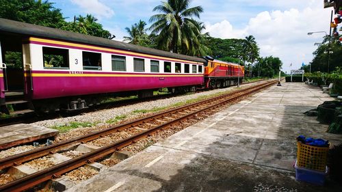 Train at railroad station against sky