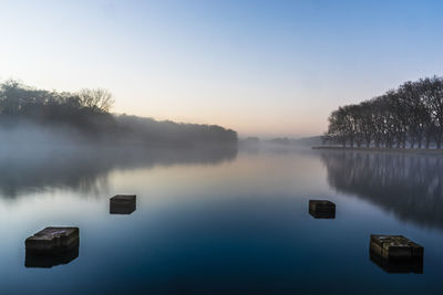 Scenic view of lake against sky during sunset