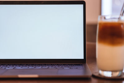 Close-up of laptop on table