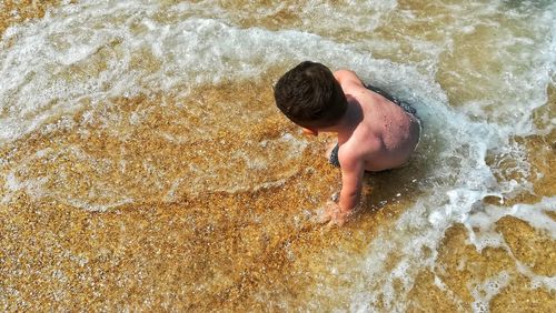 High angle view of boy in water