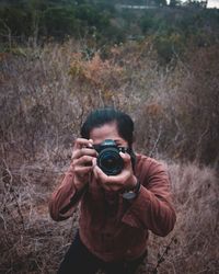 Portrait of man photographing