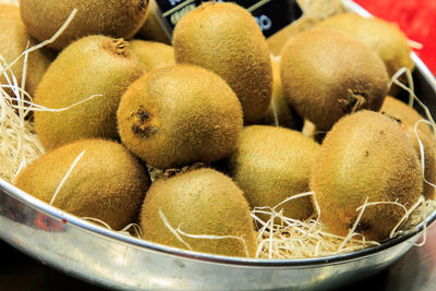 Group of kiwis in a basket for sale