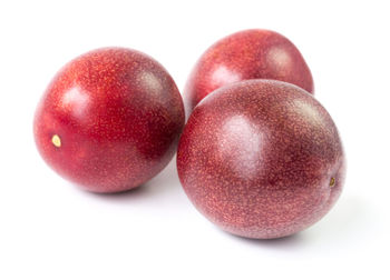 Close-up of cherries over white background