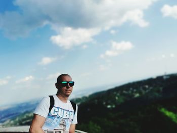 Man wearing sunglasses against sky