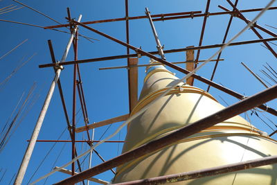 Low angle view of telephone pole against sky