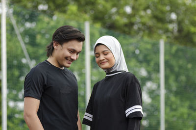 Young couple standing outdoors