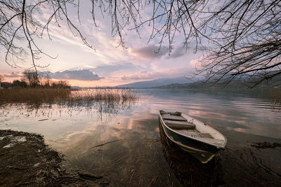 Scenic view of lake against sky during sunset