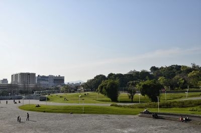 Scenic view of grassy field against cloudy sky