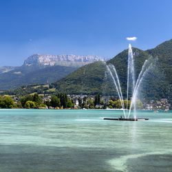 Scenic view of waterfall against sky