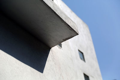 Low angle view of building against blue sky