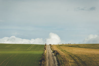 Panoramic shot of agricultural field against sky