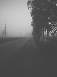 Empty road in foggy weather