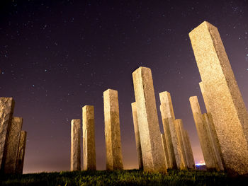 Low angle view of historical building against sky at night