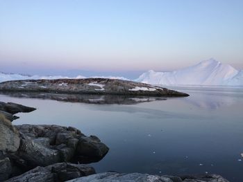 Scenic view of lake with mountains in background