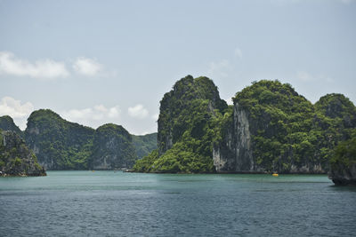 Scenic view of mountains against cloudy sky