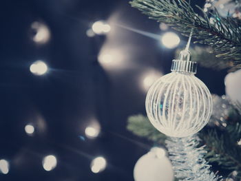 Close-up of illuminated christmas tree at night