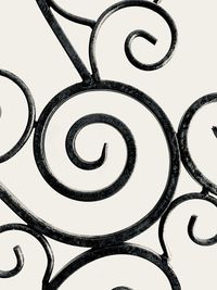 Full frame shot of metal fence against white background