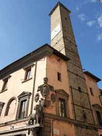 Low angle view of clock tower against sky