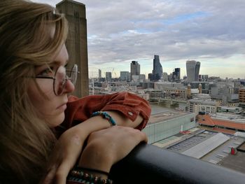 Young woman looking at cityscape