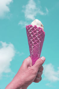 Hand holding ice cream cone