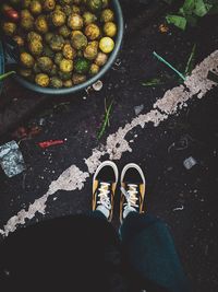 Low section of person standing on street