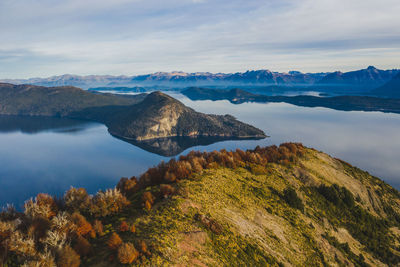 Scenic view of lake and mountains against sky