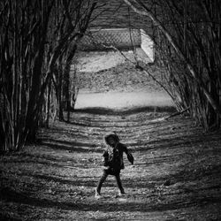 Full length of woman standing by railing