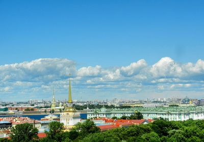 View of cityscape against blue sky