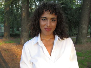 Portrait of a smiling young woman in forest