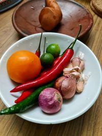 High angle view of fruits in plate on table