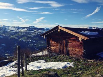 Houses on snow covered mountain