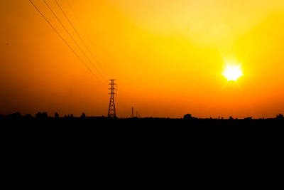 Silhouette landscape against romantic sky at sunset