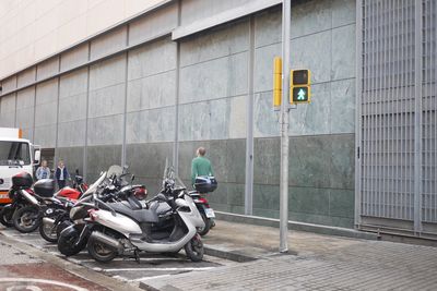 Man cycling on building