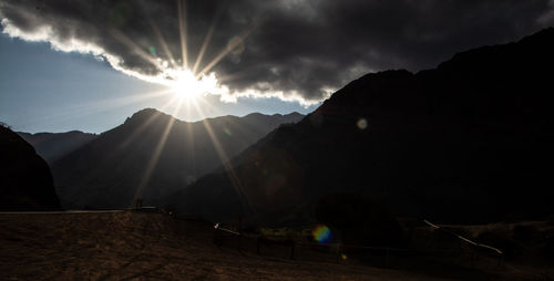 Scenic view of silhouette mountains against sky