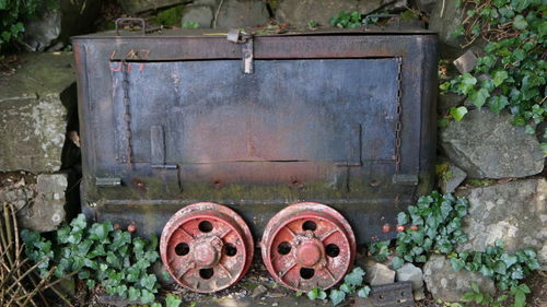 Old rusty metal structure in yard