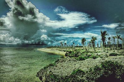 Scenic view of sea against cloudy sky