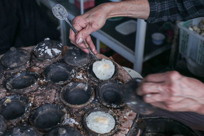 Midsection of person preparing food