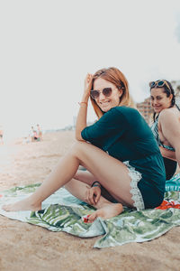 Portrait of a young woman sitting on beach