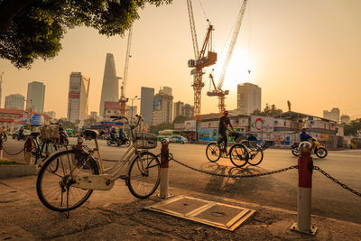 Bicycles in city at sunset