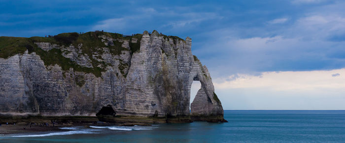 Scenic view of sea against cloudy sky