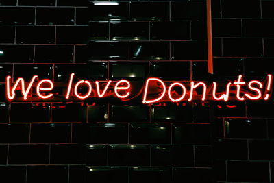 Close-up of illuminated neon sign at night