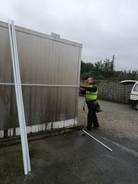 Man working at construction site against sky