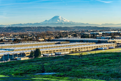 A view of tukwila, washington with mount rainier in the distance.